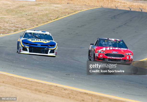 Chase Elliott, driving the # Chevrolet for Hendrick Motorsports and Kurt Busch, driving the negotiate turn 8 on Friday, June 22, 2018 at the...
