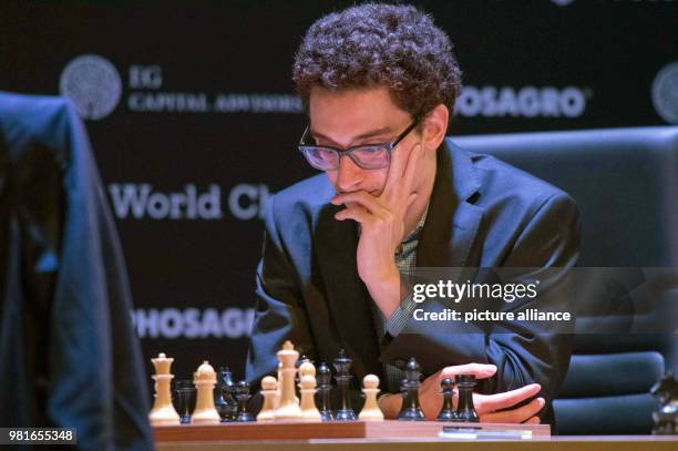 March 2018, Germany, Berlin: Fabiano Caruana, a US-American and Italian chess grand master, and Grischuk , chess grand master of Russia, playing at...