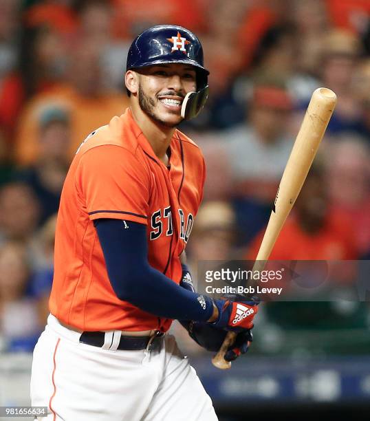 Carlos Correa of the Houston Astros reacts after striking out in the fourth inning against the Kansas City Royals at Minute Maid Park on June 22,...