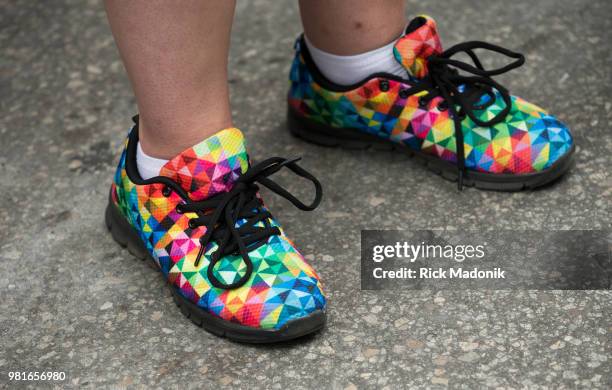 If the shoe fits! A woman wears rainbow shoes for the Trans march. The Trans rally and march has become a regular part of the final PRIDE weekend...
