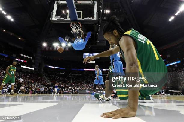 Corey Maggette of Power dunks after Josh Childress of Ball Hogs is blocked attempting a layup during week one of the BIG3 three on three basketball...