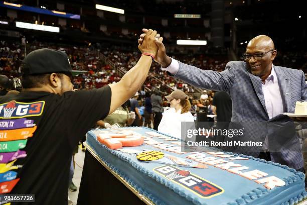 League Co-Founder, Ice Cube, presents Commissioner, Clyde Drexler, with a birthday cake during week one of the BIG3 three on three basketball league...