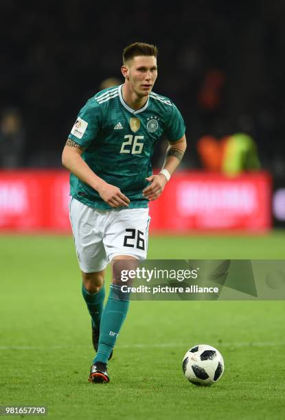 March 2018, Germany, Berlin, Olympia Stadium: Soccer, Friendly International match, Germany vs Brazil: Niklas Suele controls the ball. Photo: Andreas...