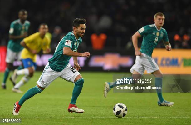 March 2018, Germany, Berlin, Olympia Stadium: Soccer, Friendly International match, Germany vs Brazil: Germany's Ilkay Gündogan controls the ball....