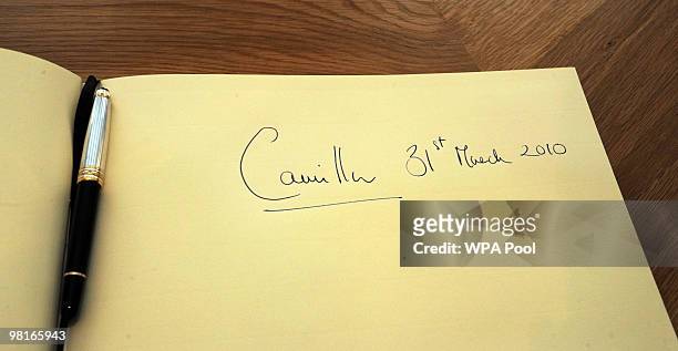 Camilla, Duchess of Cornwall's signature is seen in the visitor's book during the visit of the Duchess of Cornwall to Chapel House, St John's...
