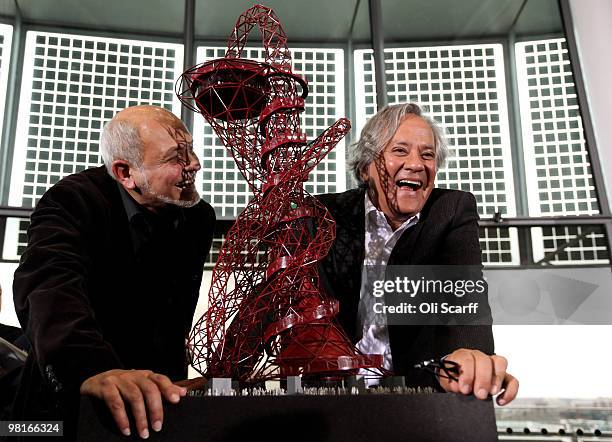 Structural designer Cecil Balmond and artist Anish Kapoor pose with Kapoor's winning design for a visitor attraction to be placed in the 2012 Olympic...