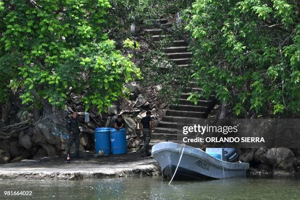 Honduran Army soldiers remain in Conejo Island, Honduras on May 27, 2018. - 'Conejo', a tiny rocky island in the Pacific, keeps an ancient border...