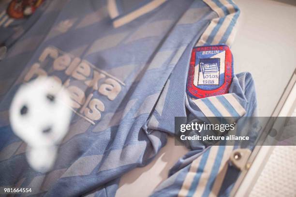 March 2018, Germany, Berlin: An old tricot of soccer club Blau-Weiß 90 Berlin of the year 1988 hangs in the club's casino 'Zur Halbzeit' on the wall....