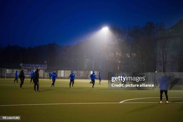 March 2018, Germany, Berlin: Players train at dusk. In the year 1986/87, Blau-Weiß 90 belonged to the best 18 teams in Germany. Nowadays the soccer...