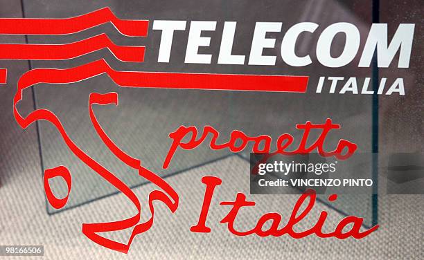 Logo, bearing the slogan:" Telecom Italia, Italian Project" covers part of the window of an Italia Telecom store in Rome's center 04 April 2007....