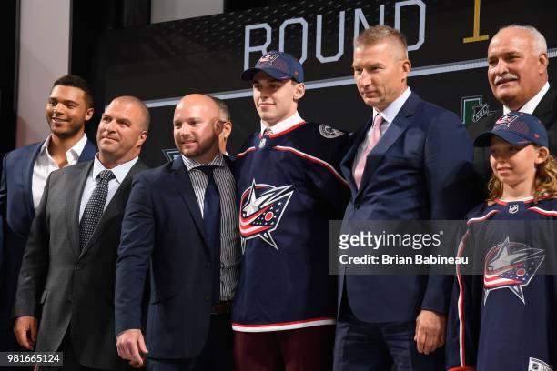 Liam Foudy poses onstage after being selected eighteenth overall by the Columbus Blue Jackets during the first round of the 2018 NHL Draft at...