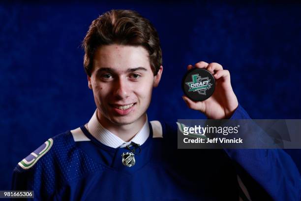 Quinton Hughes poses for a portrait after being selected seventh overall by the Vancouver Canucks during the first round of the 2018 NHL Draft at...