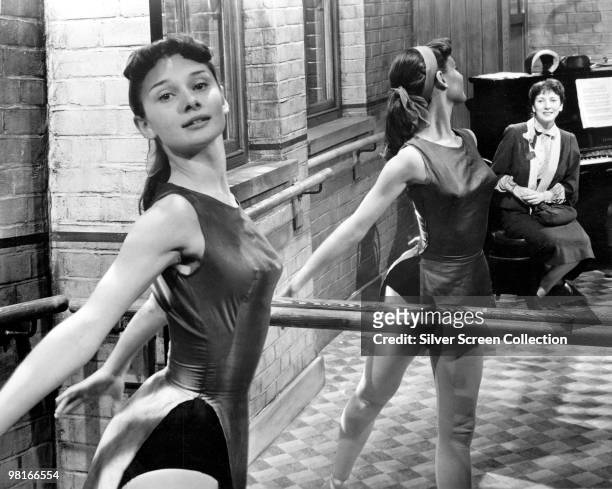 British actress and dancer Audrey Hepburn rehearsing at the barre, circa 1950.