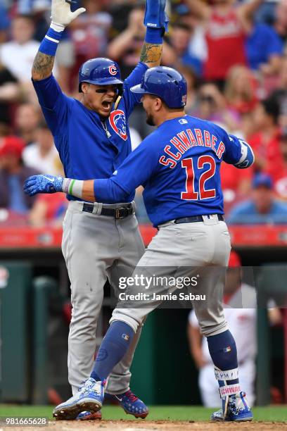 Javier Baez of the Chicago Cubs celebrates at home plate with Kyle Schwarber of the Chicago Cubs after Schwarber's two-run home run in the fourth...