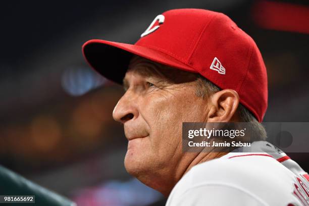 Interim Manager Jim Riggleman of the Cincinnati Reds watches from the dugout in the eighth inning as his team plays the Chicago Cubs at Great...