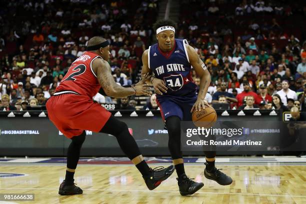 David Hawkins of Tri State drives against Rashad McCants of Trilogy during week one of the BIG3 three on three basketball league at Toyota Center on...