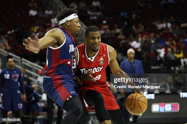 James White of Trilogy drives against David Hawkins of Tri State during week one of the BIG3 three on three basketball league at Toyota Center on...