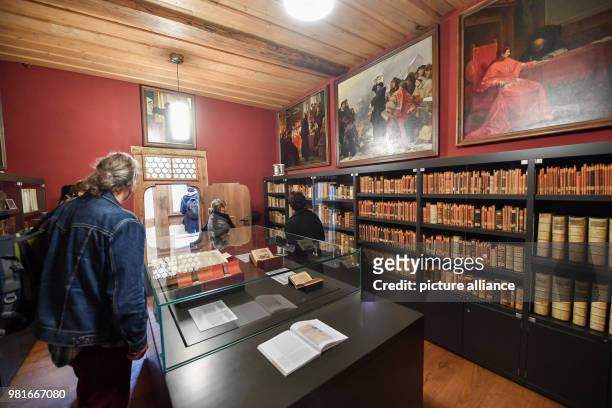 March 2018, Germany, Eisenach: The library is part of the exhibition '950 years Wartburg', which allows visitors to stroll through several show rooms...