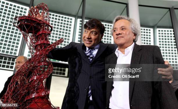 Steel magnate Lakshmi Mittal and artist Anish Kapoor pose with Kapoor's winning design for a visitor attraction to be placed in the 2012 Olympic...