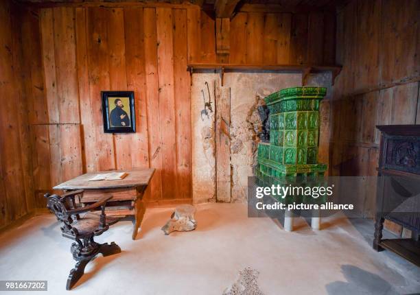 March 2018, Germany, Eisenach: The historic writing desk of Martin Luther is part of the exhibition '950 years Wartburg', which allows visitors to...