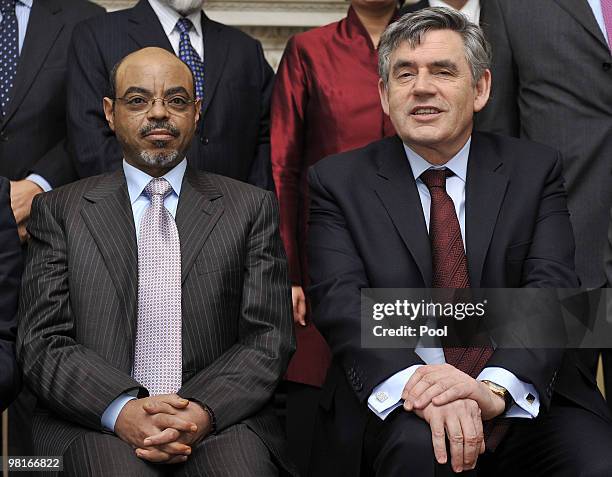 British Prime Minister Gordon Brown poses with Ethiopia's Prime Minister Meles Zenawi and as he hosts the Climate Finance Group at 10 Downing Street...