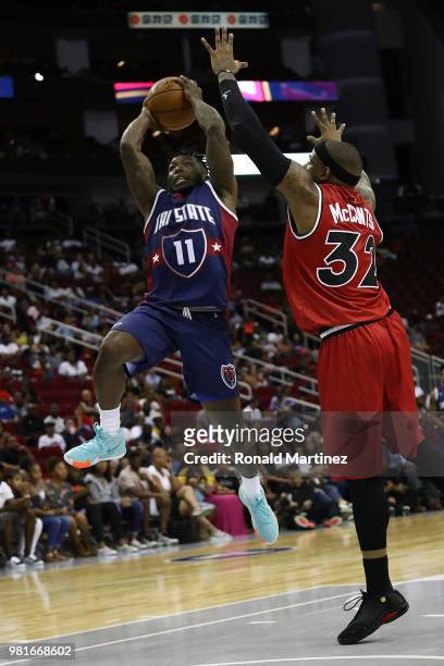 Nate Robinson of Tri State shoots against Rashad McCants of Trilogy during week one of the BIG3 three on three basketball league at Toyota Center on...