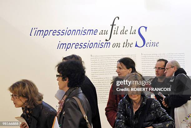 People arrive to visit the exhibition "Impressionism along the Seine" on March 31, 2010 in Giver, as part of the Normandie Impressionniste festival...