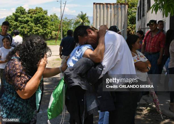 An Honduran immigrant is received by his family at the Ramon Villeda Morales airport, in San Pedro Sula, 200 kilometres north of Tegucigalpa, after...
