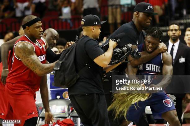Rashad McCants of Trilogy and Nate Robinson of Tri State argue after the game during week one of the BIG3 three on three basketball league at Toyota...