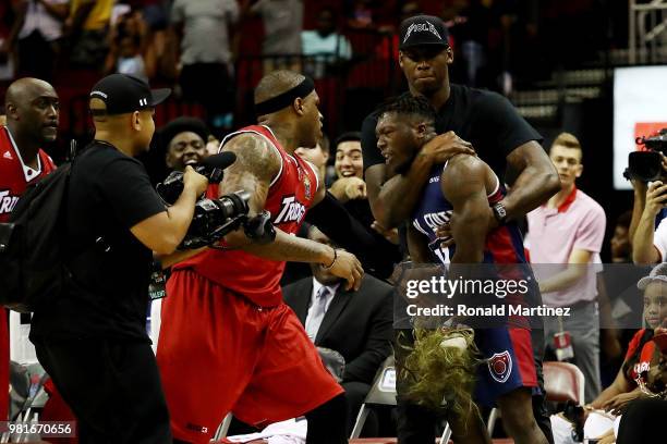 Rashad McCants of Trilogy and Nate Robinson of Tri State argue after the game during week one of the BIG3 three on three basketball league at Toyota...