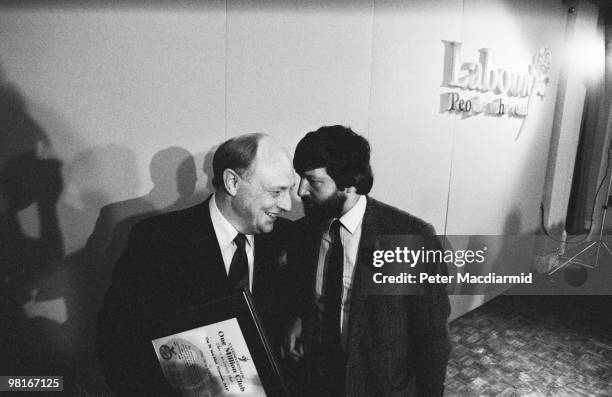 British Labour Party leader Neil Kinnock with MP David Blunkett at a press conference on the poll tax, London, 30th April 1990.