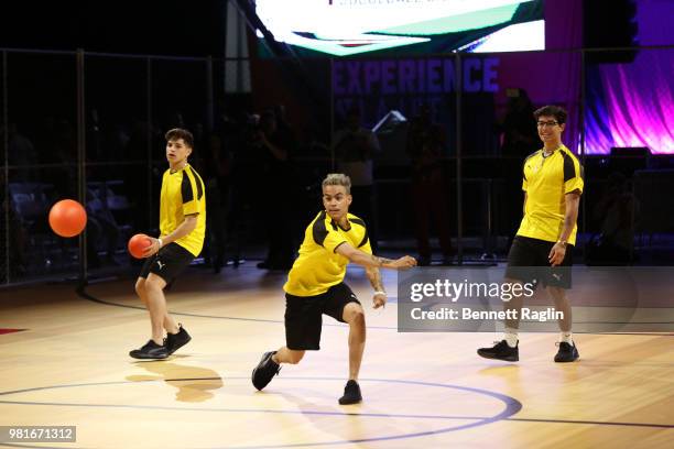 Nick Mara, Edwin Honoret and Brandon Arreaga of PrettyMuch compete during the Celebrity Dodgeball Game at 2018 BET Experience Fan Fest at Los Angeles...