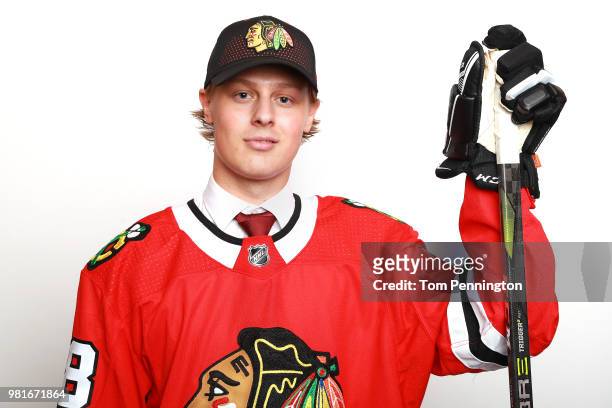 Adam Boqvist poses after being selected eighth overall by the Chicago Blackhawks during the first round of the 2018 NHL Draft at American Airlines...