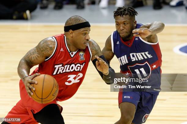 Rashad McCants of Trilogy drives against Nate Robinson of Tri State during week one of the BIG3 three on three basketball league at Toyota Center on...