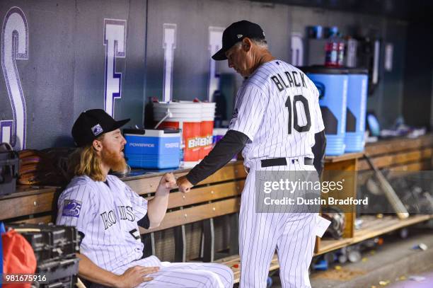 Bud Black of the Colorado Rockies congratulates Jon Gray after Gray's seventh inning, twelve strikeout performance against the Miami Marlins at Coors...