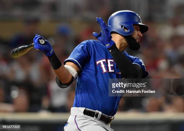 Nomar Mazara of the Texas Rangers hits a two-run single against the Minnesota Twins during the ninth inning of the game on June 22, 2018 at Target...
