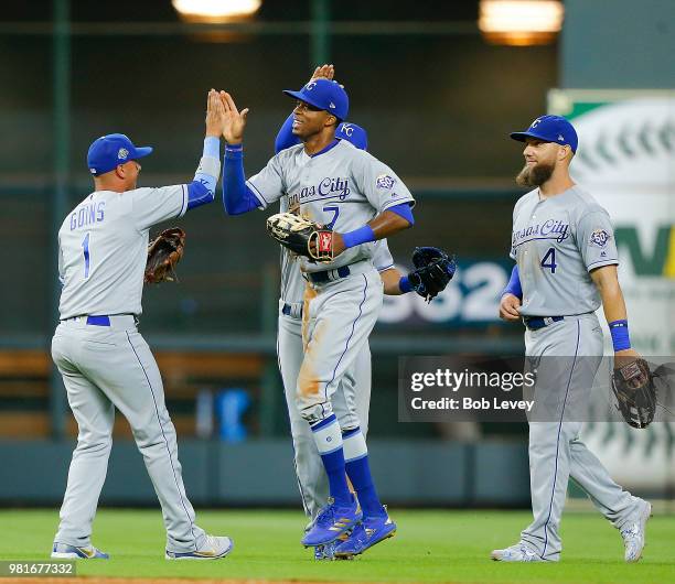 Rosell Herrera of the Kansas City Royals high fives Ryan Goins after the final out of the game against the Houston Astros at Minute Maid Park on June...