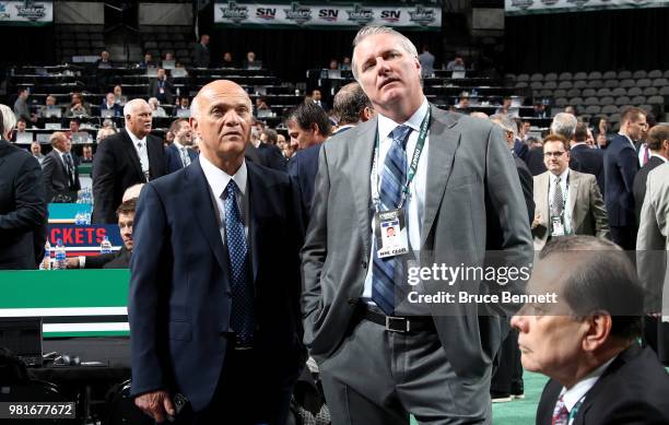 Lou Lamoriello and Garth Snow of the New York Islanders look at the draft board prior to the first round of the 2018 NHL Draft at American Airlines...