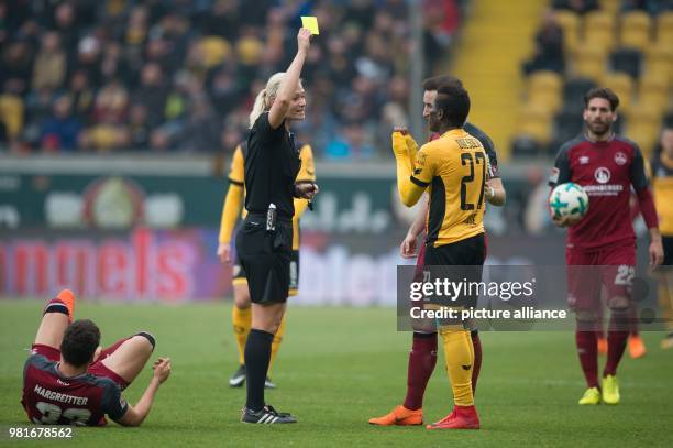 March 2018, Germany, Dresden: 2nd Bundesliga, Dynamo Dresden vs 1. FC Nuremberg in the DDV Stadium: Match referee Bibiana Steinhaus showing the...