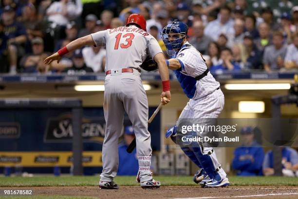 Manny Pina of the Milwaukee Brewers tags out Matt Carpenter of the St. Louis Cardinals after a dropped third strike in the seventh inning at Miller...