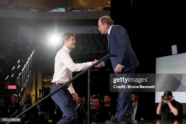 Joel Farabee shakes hands with NHL commissioner Gary Bettman after being selected fourteenth overall by the Philadelphia Flyers during the first...