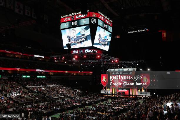 The jumbotron shows Brady Tkachuk after being selected fourth overall by the Ottawa Senators during the first round of the 2018 NHL Draft at American...