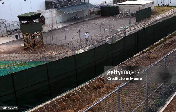 Detainees jog inside a recreation yard at Camp 6 in the Guantanamo Bay detention center on March 30, 2010 in Guantanamo Bay, Cuba. U.S. President...