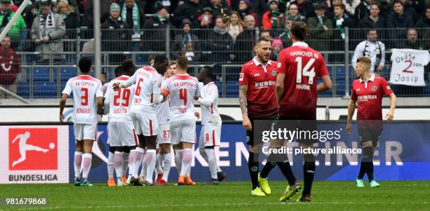 March 2018, Germany, Hannover: soccer, Bundesliga, Hannover 96 vs RB Leipzig in the HDI Arena. Leipzig's Emil Forsberg and teammates celebrating his...