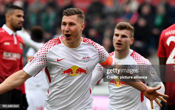 March 2018, Germany, Hannover: soccer, Bundesliga, Hannover 96 vs RB Leipzig in the HDI ArenA. Leipzig's Willi Orban and Timo Werner celebrating the...