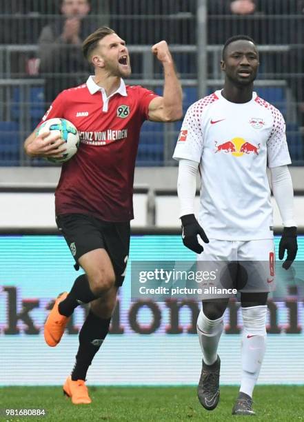 March 2018, Germany, Hannover: soccer, Bundesliga, Hannover 96 vs RB Leipzig in the HDI Arena. Hannover's Niclas Fuellkrug celebrating his scoring of...