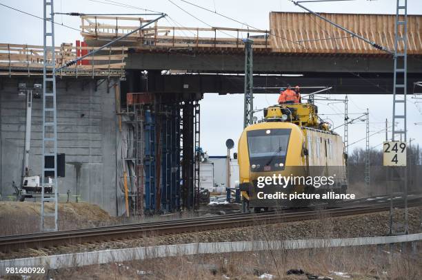 March 2018, Germany, Bergen: Employees of the railway work on the overhead lines at the track between Bergen and Samtens on the island of Ruegen. The...