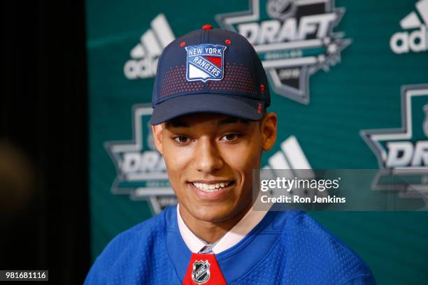 Andre Miller speaks to the media after being selected twenty-second overall by the New York Rangers during the first round of the 2018 NHL Draft at...