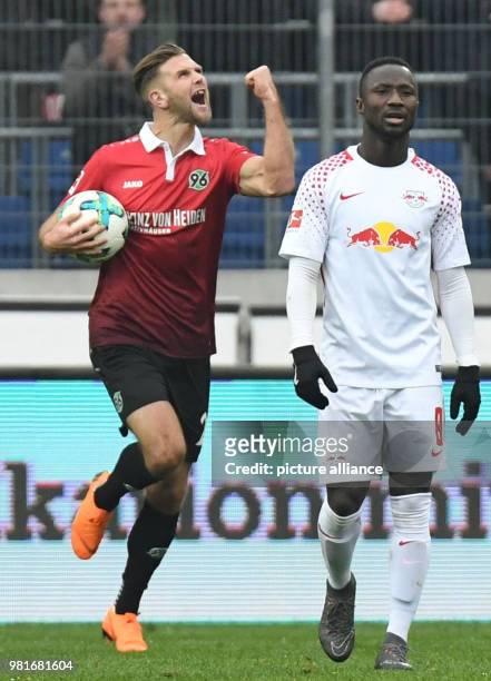 Hannover's Niclas Fuellkrug celebrates scoring his side's second goal during the German Bundesliga soccer match between Hannover 96 and RB Leipzig...