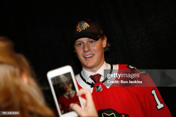 Adam Boqvist smiles after being selected eighth overall by the Chicago Blackhawks during the first round of the 2018 NHL Draft at American Airlines...